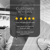 A promotional graphic with a black-and-white photo of a woman holding a wooden heart-shaped object, overlaid with a dark translucent panel that reads 'CUSTOMER REVIEWS' and three review quotes with five yellow stars.
